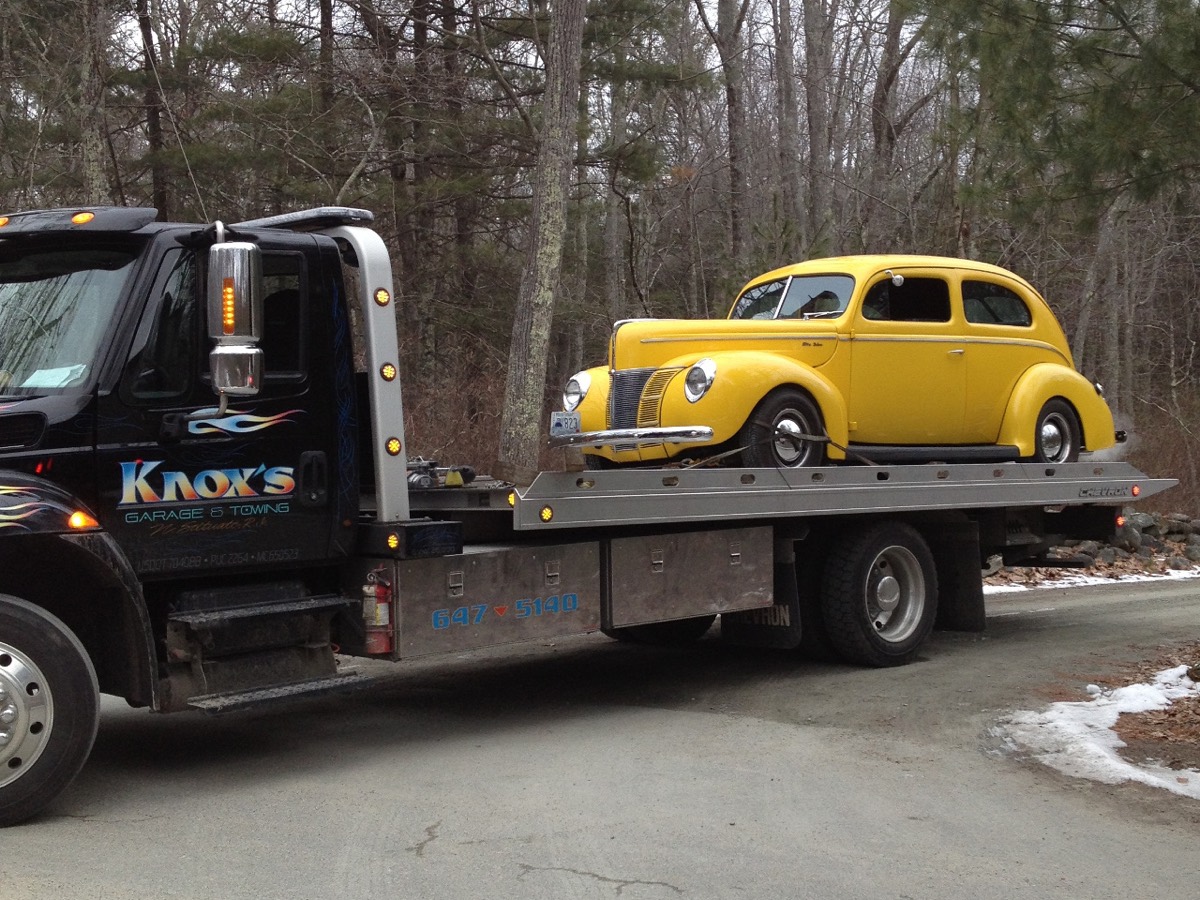 Classic yellow coupe on a Knox's flatbed